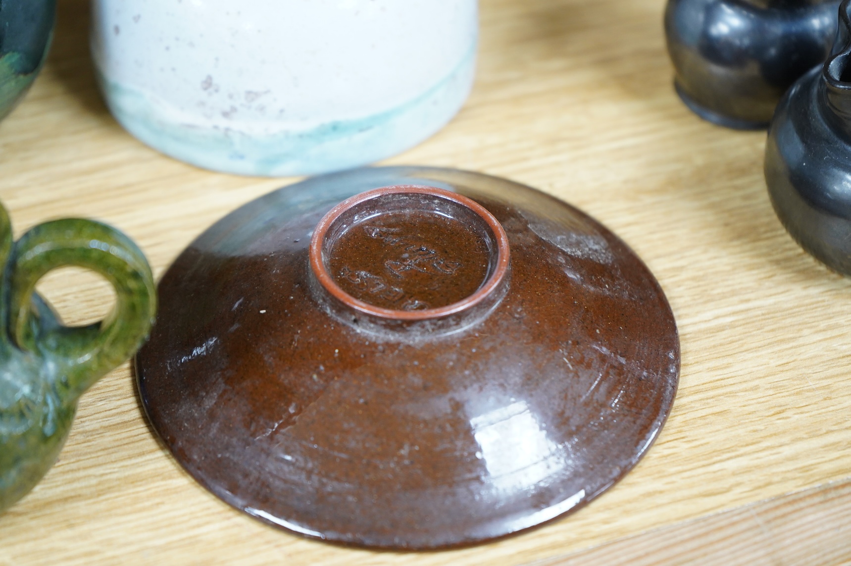 A collection of studio pottery to include a small Danish squat vase, a Brannam, Devon vase and three small Dickerware pieces, largest 13cm high